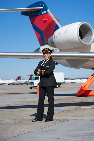 Anya in front of plane