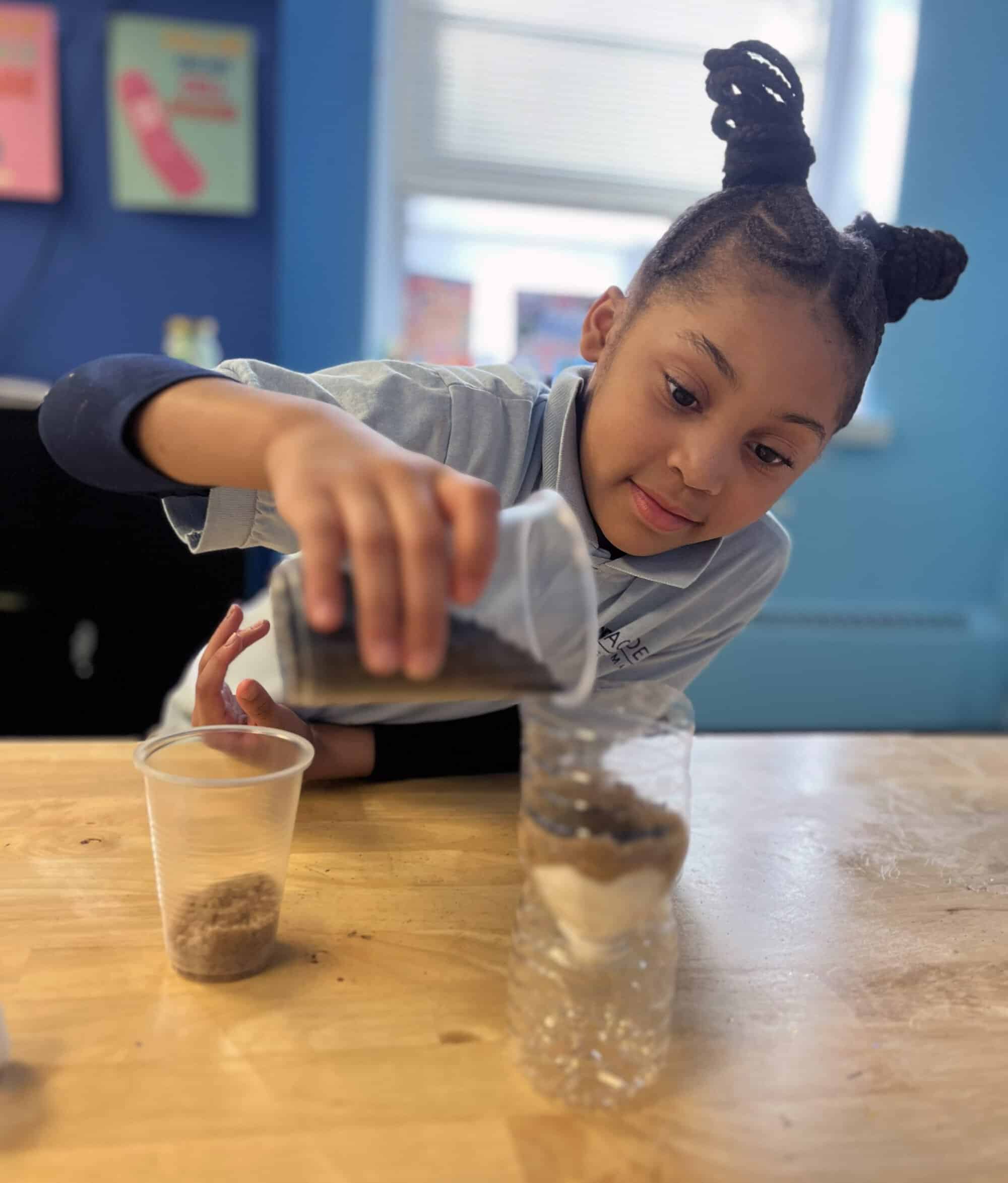 girl doing science experiment